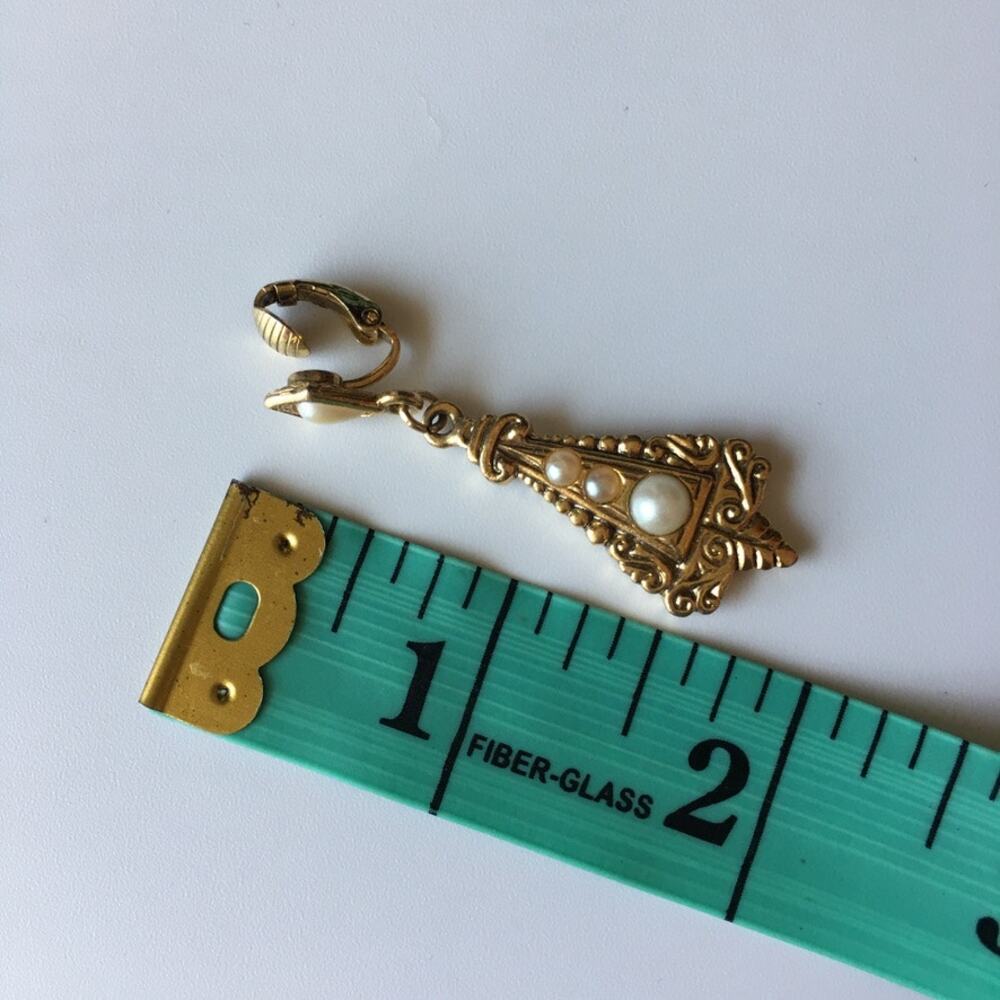 Ornate gold tone and faux pearl accent clip on earrings - Picture 5 of 7